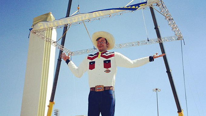 Unveiling of the new Big Tex dressed in jeans and a white button down. 