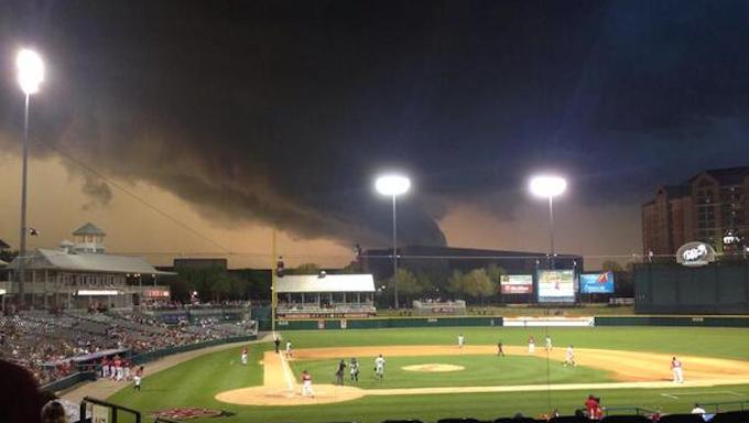 Tornado looming above Frisco Baseball field. 